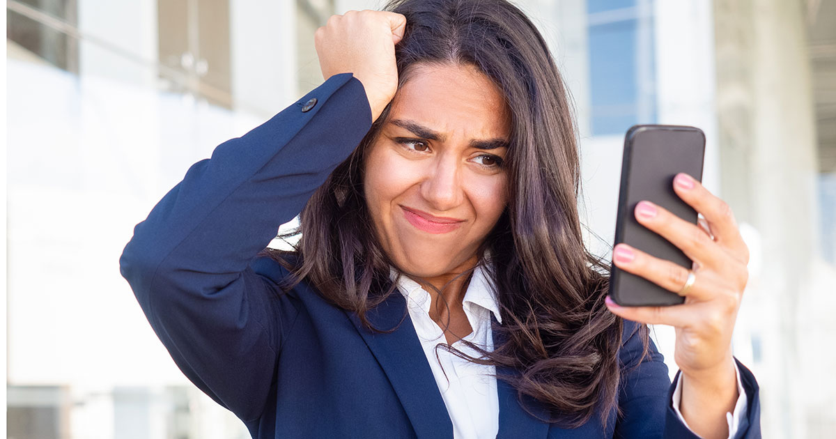 attorney pulls hair while looking at phone