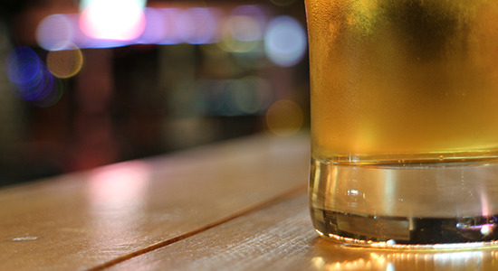 Glass of beer on bar