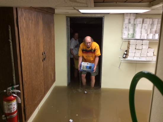 Joe Hasler carrying items out of law office