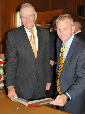 Adrian Schoone and Robert Keller with Racine County Bar Association Roll Book