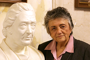 Chief Justice Abrahamson poses with bust of Chief Justice Edward G. Ryan