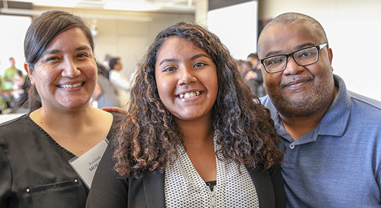 Anya Ramos, center, pictured with parents Roslinda Moreno and Carols Ramos, plans to become a lawyer
