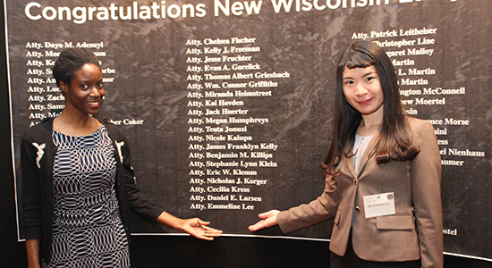 Emmeline Lee points to name on name wall.