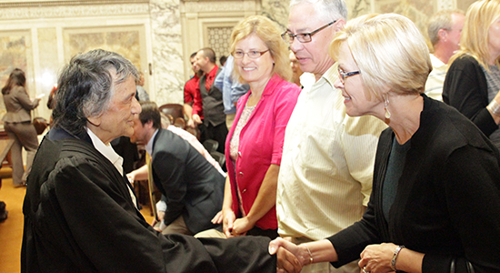 Justice Shirley Abrahamson speaks with family members of the newly sworn lawyers.