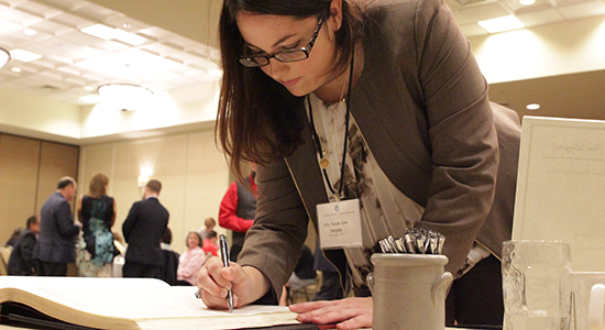 Sarah Ann Sargent signs the Supreme Court Roll.  