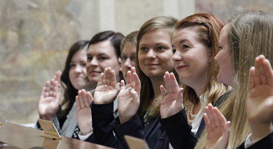 New Wisconsin lawyers take the Attorney's Oath in a ceremony in Madison.