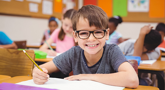 smiling child in a classroom