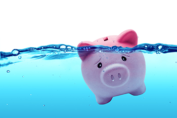 piggy bank sinking in water