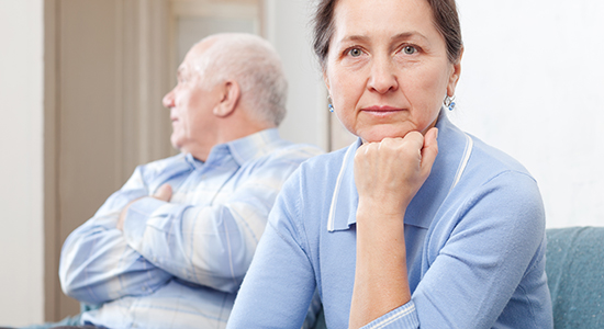 elderly woman stares at camera