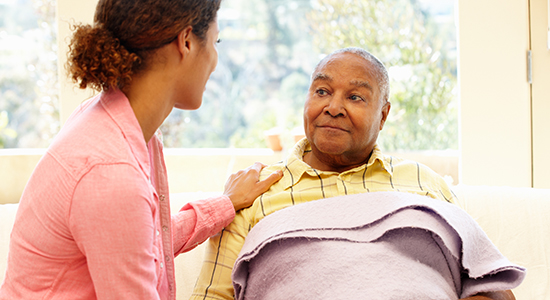 woman caring for elderly man