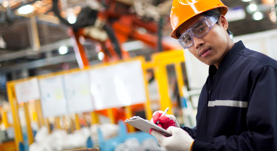 factory worker looking at camera