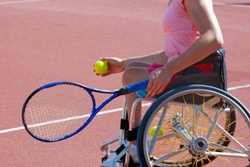 Woman in wheelchair plays tennis