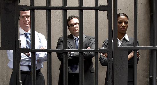 lawyers look through prison bars