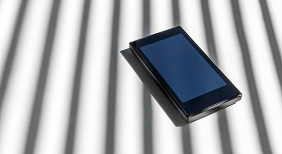 smartphone with prison bars shadow