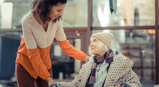 helping elderly woman