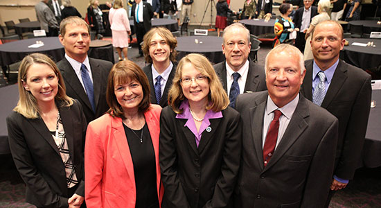 Kastner poses with friends and family