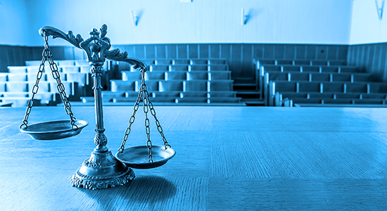 scales of justice in courtroom