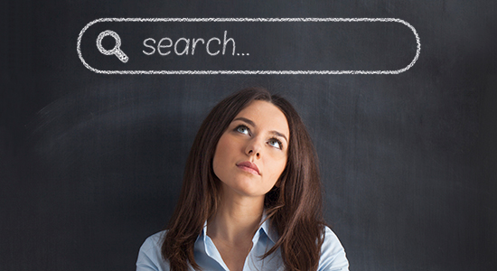 businesswoman thinking with search bar on chalkboard
