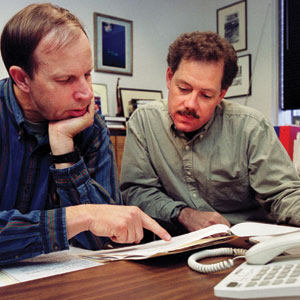 Law School professors John Pray       (left) and Keith Findley review applications requesting legal assistance         from the Wisconsin Innocence Project
