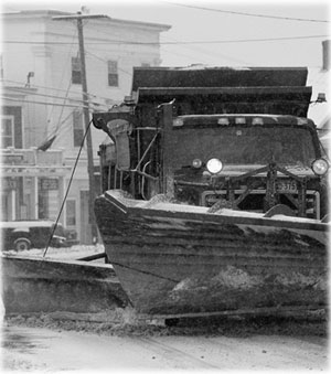 Photo: Snowplow on city street