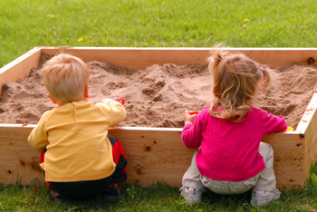 children playing in a sandbox