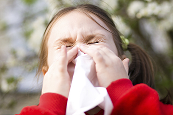 girl sneezing