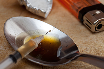 heroin syringe and spoon