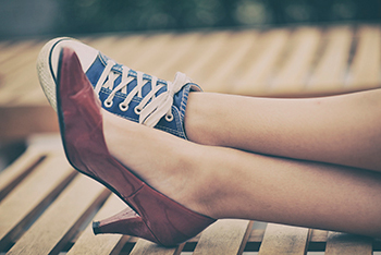 feet with high heel and sneaker