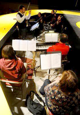 Joe Cardamone conducting pit band