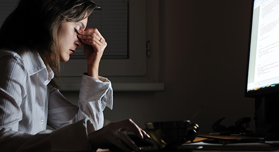 businesswoman stressed at desk