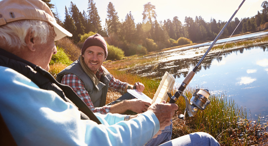 man fishing with elderly father