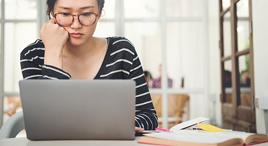 woman looking at laptop