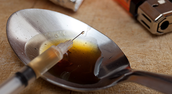 heroin needle and spoon