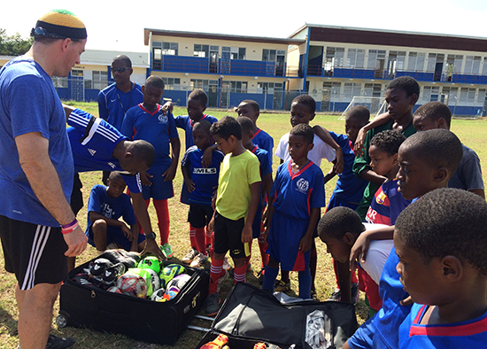 Aaron Frederickson and children in Jamaica