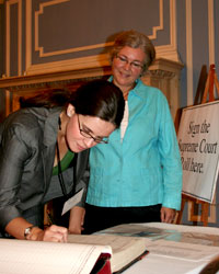 New member Tristan Breedlove signs the supreme court roll