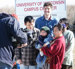 Troy Mayne with Hmong Family