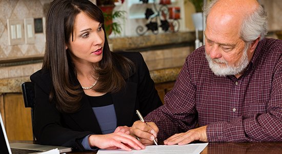 attorney assisting elderly man