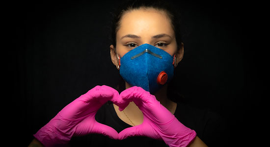 woman smiling in facemask