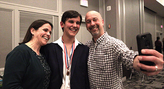 Whitefish Bay junior Kellen Szumski poses with his parents