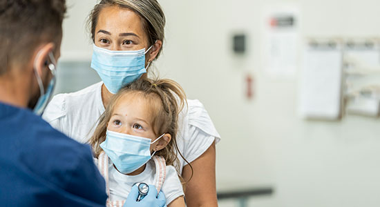 mother daughter doctor check up