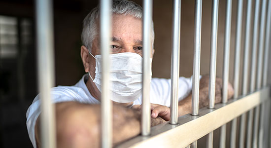 elderly prisoner in facemask