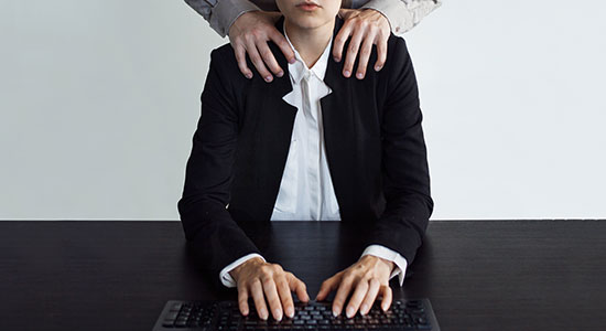 man putting hands on woman's shoulder