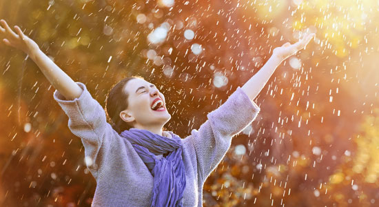 woman smiling in the rain