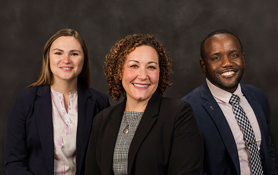 Ryan Poe-Gavlinski (center) and her students, Chelsea Thibodeaux and Taijae Evans