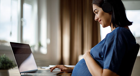 pregant woman working at desk