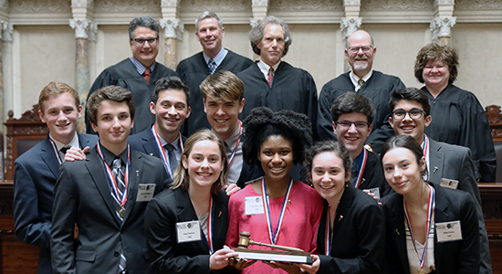 The 2018 State Champion team from Shorewood High School. Center in the back is Judge Stephen Crocker, who volunteered as presiding judge for the final round in March 2018.