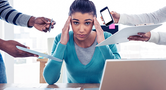 business woman overwhelmed with distractions