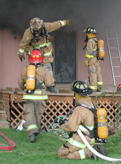 Dean Richards and Lance Grady fight a fire